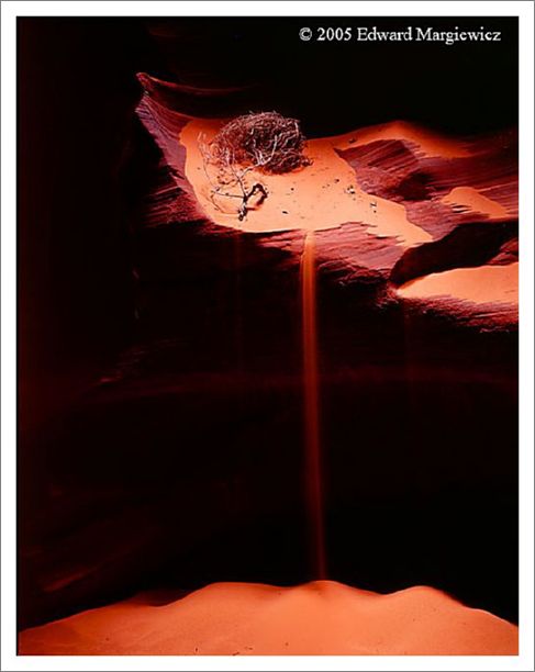 450397---The crying face created by sand falling into the canyon during a wind strorm